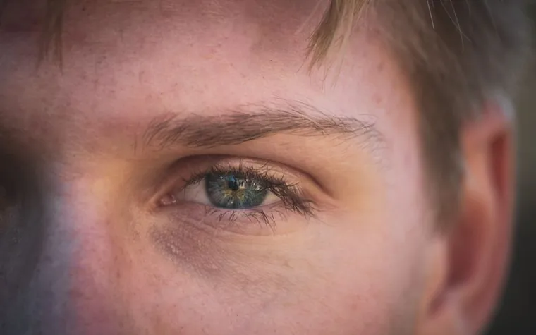 Close-up portrait showing detailed skin texture near the eye