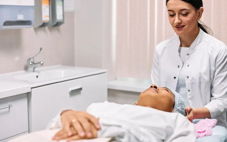 Dermatologist consulting with a patient