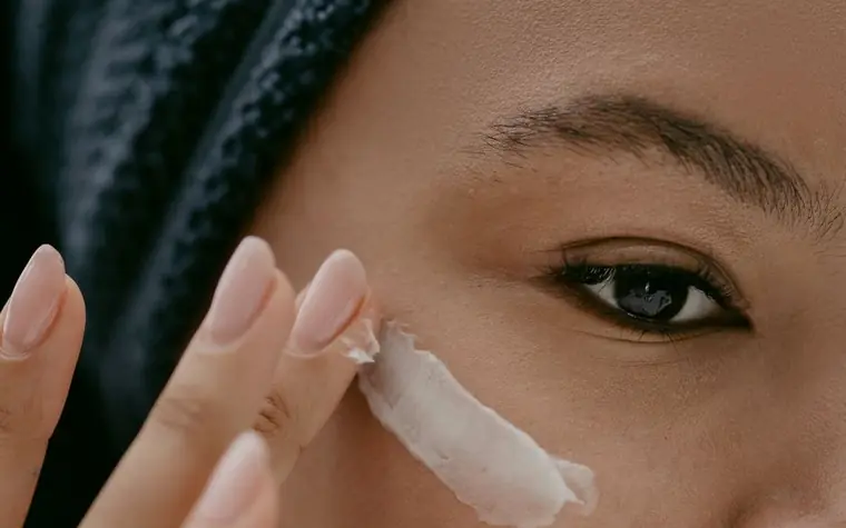 Applying eye cream near the under-eye area