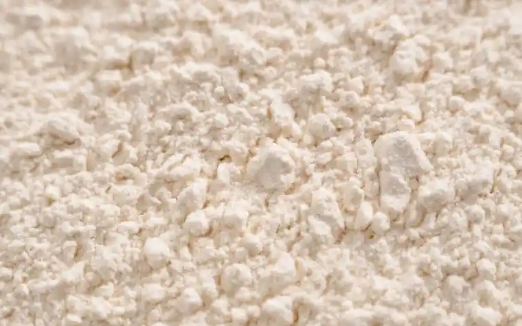 Macro close-up of a fine white cosmetic powder texture
