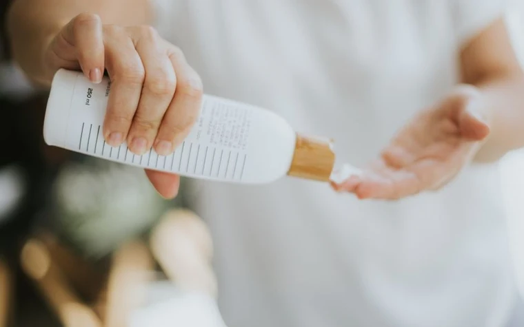 Close-up of lotion being poured from a bottle