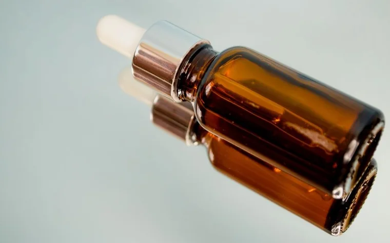 Close-up of a dropper bottle with oil formulation