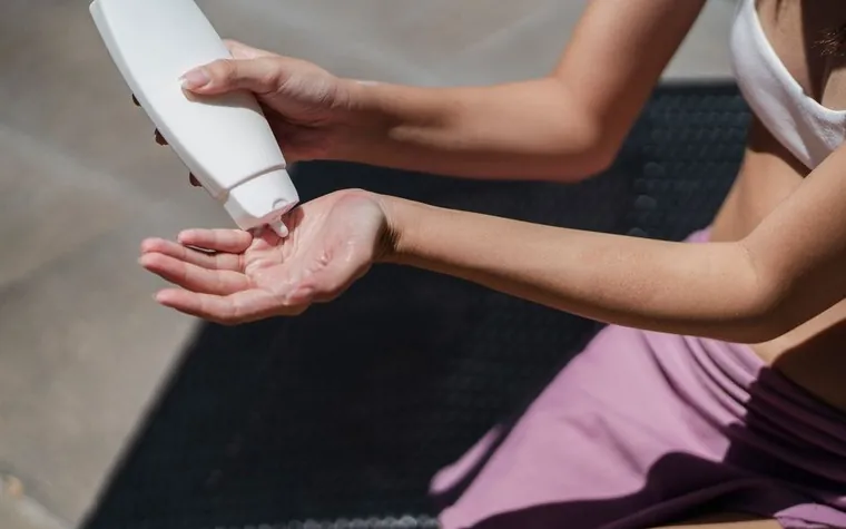 Sunscreen being applied from an overhead angle