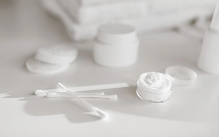 Skincare products arranged on a bathroom counter