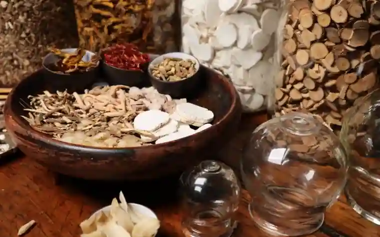 A bowl of assorted dried herbal roots and botanical ingredients