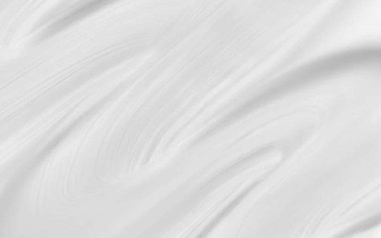 Close-up of a creamy moisturizer texture with swirling patterns