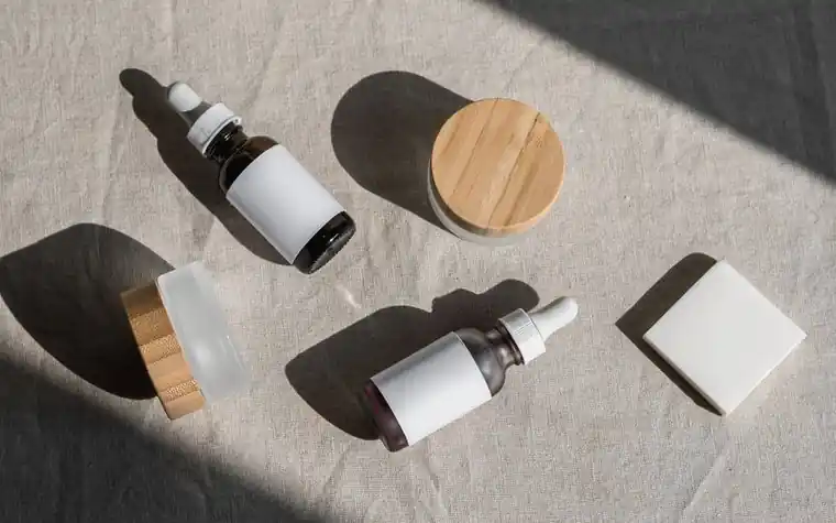 Skincare products arranged near a sunlit window