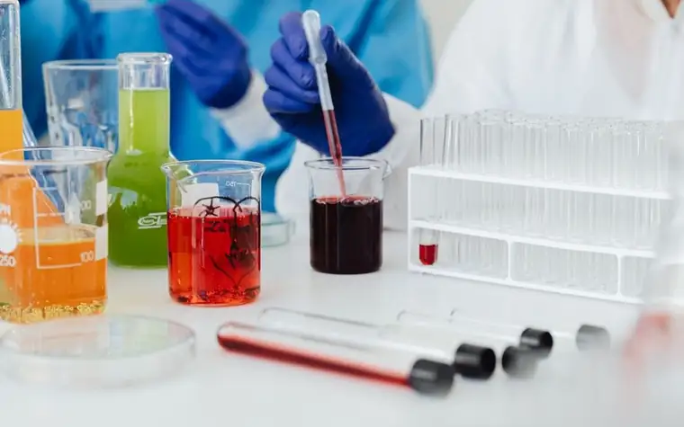 Scientists conducting a colorful laboratory experiment with test tubes