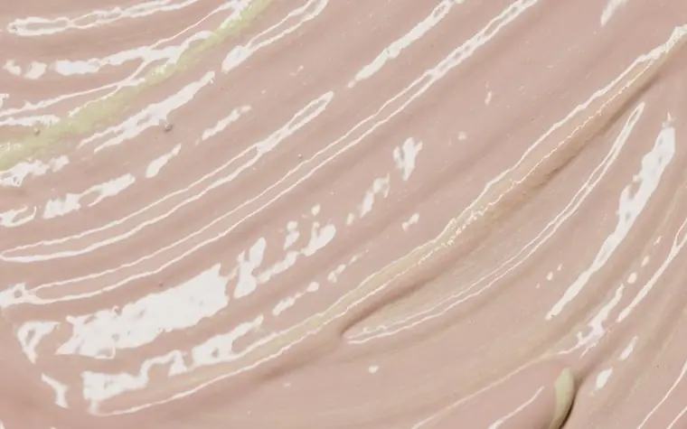 Close-up of a beige cream texture swatch