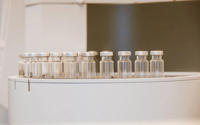 Glass vials arranged in a laboratory setting