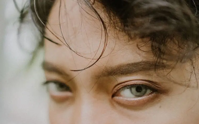 A close-up of a face showing the forehead and the area around the eyes