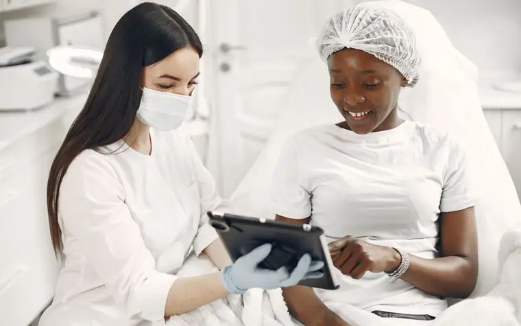 A dermatologist consulting with a patient about their skin type