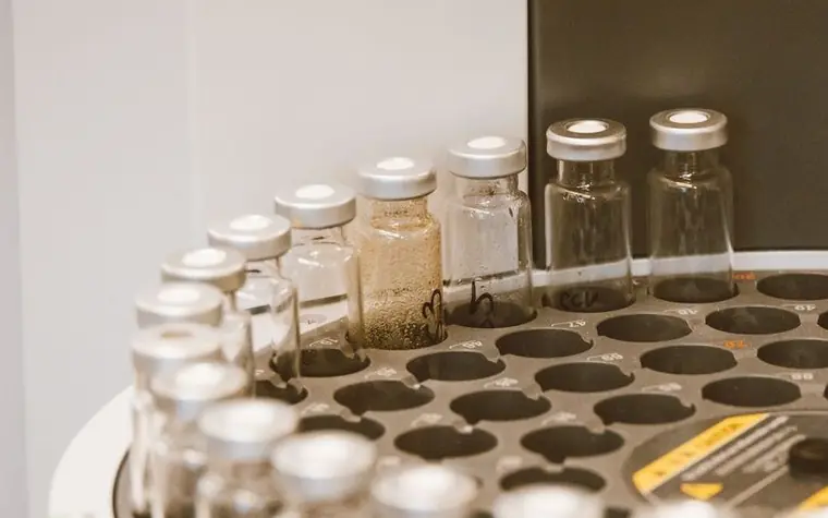 Amber glass sample vials arranged in a laboratory storage rack